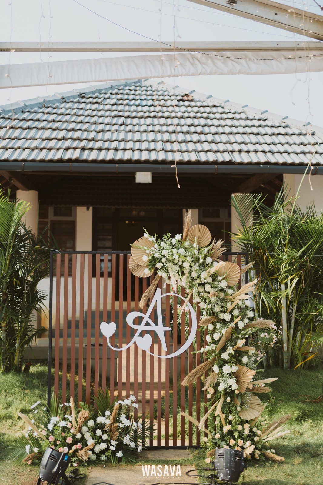 Monogram Entrance Arch — stage & decor by Wasava Wedding Planners at Baby Beach Road, Kannur, Kerala
