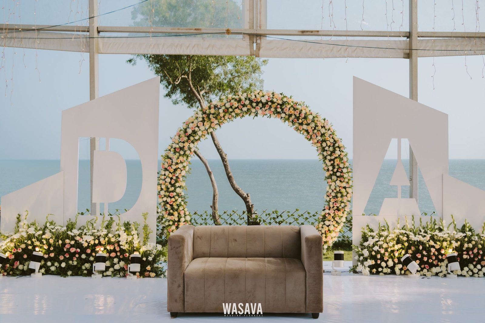 Reception Stage, Marigold & Gold — stage & decor by Wasava Wedding Planners at Baby Beach, Kannur, Kerala