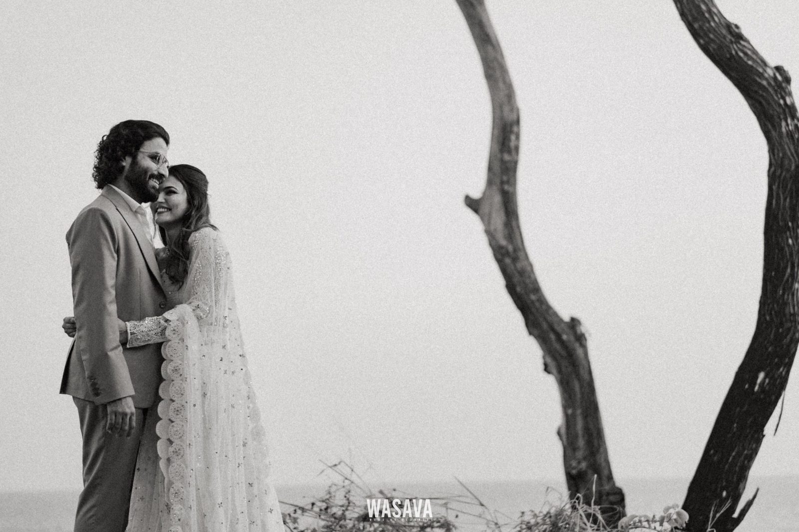 Driftwood & Salt Air — couple portraits by Wasava Wedding Planners at Baby Beach, Kannur, Kerala